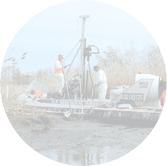 Transparent image of USGS scientists aboard the Hoverprobe and support craft at Aberdeen Proving Ground, Maryland.