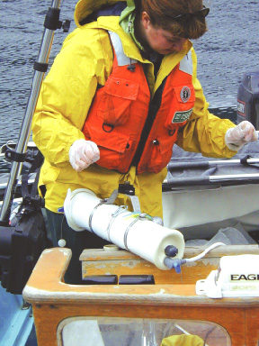 Photo: A USGS scientist collects water samples from Detroit Lake for water-quality analysis.